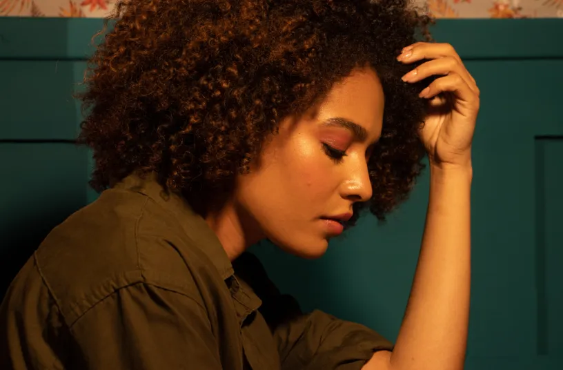 gold buddha figurine on brown rock