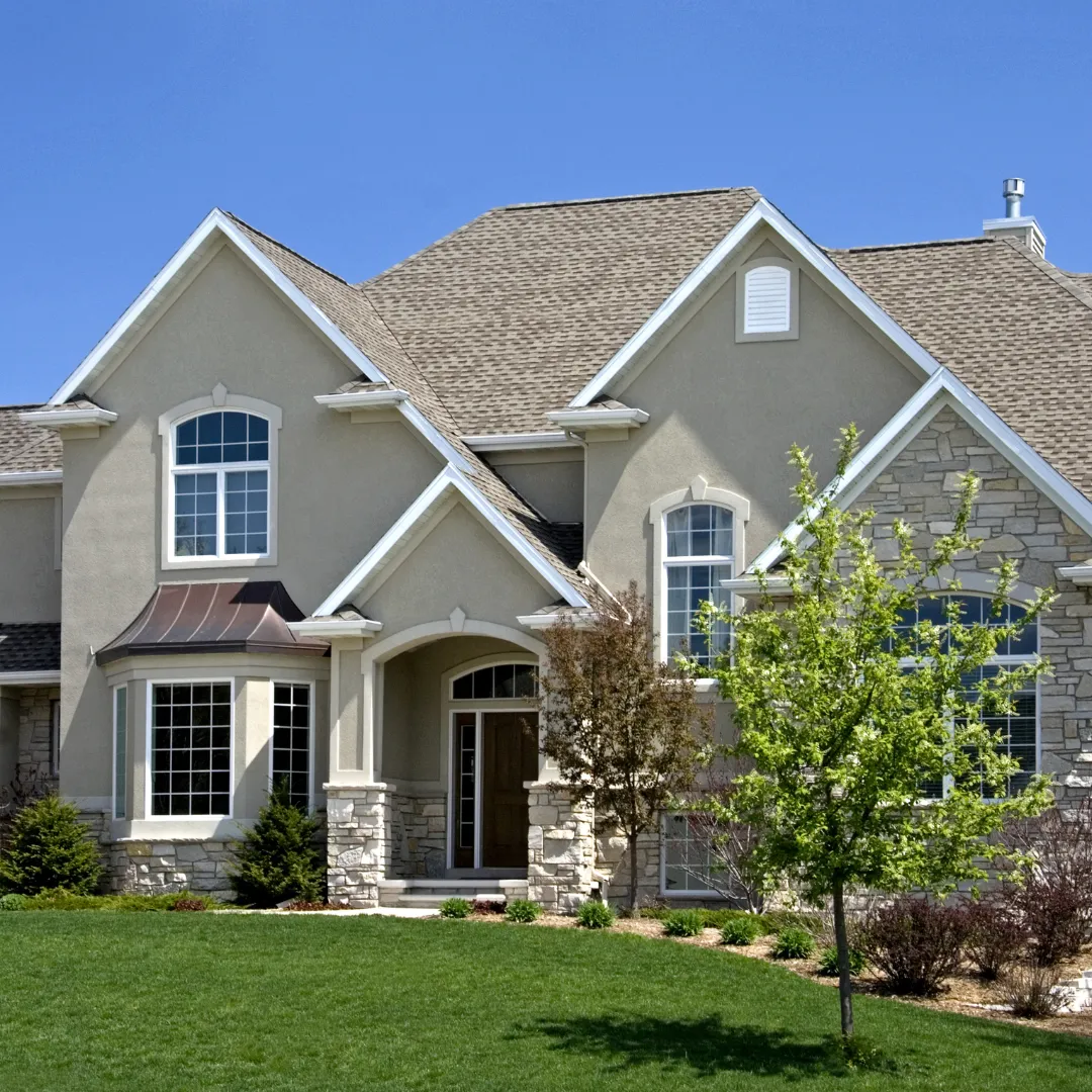 home building with new custom stucco house front yard and landscaping in egg harbor City NJ