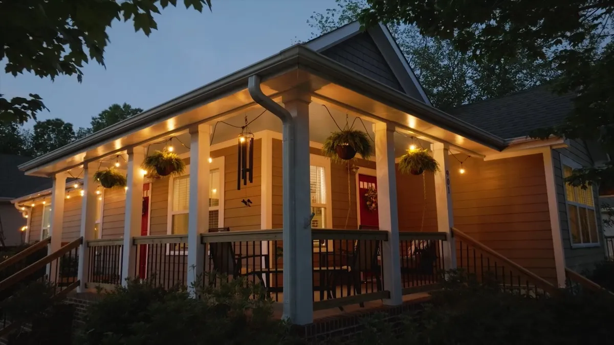 Illuminated covered porch photographed at twilight