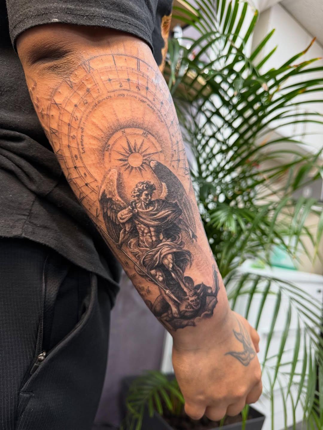 person with tattoo on right arm