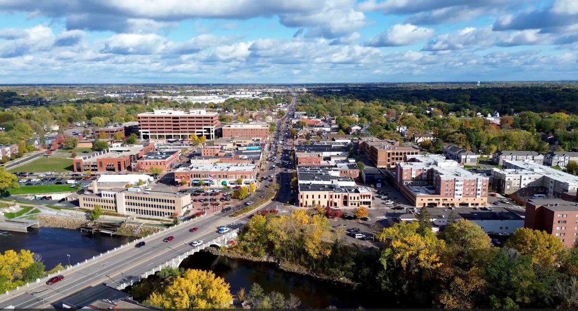 Tree lined river and bridge representing SoPURE Cleaning Services in Anoka County