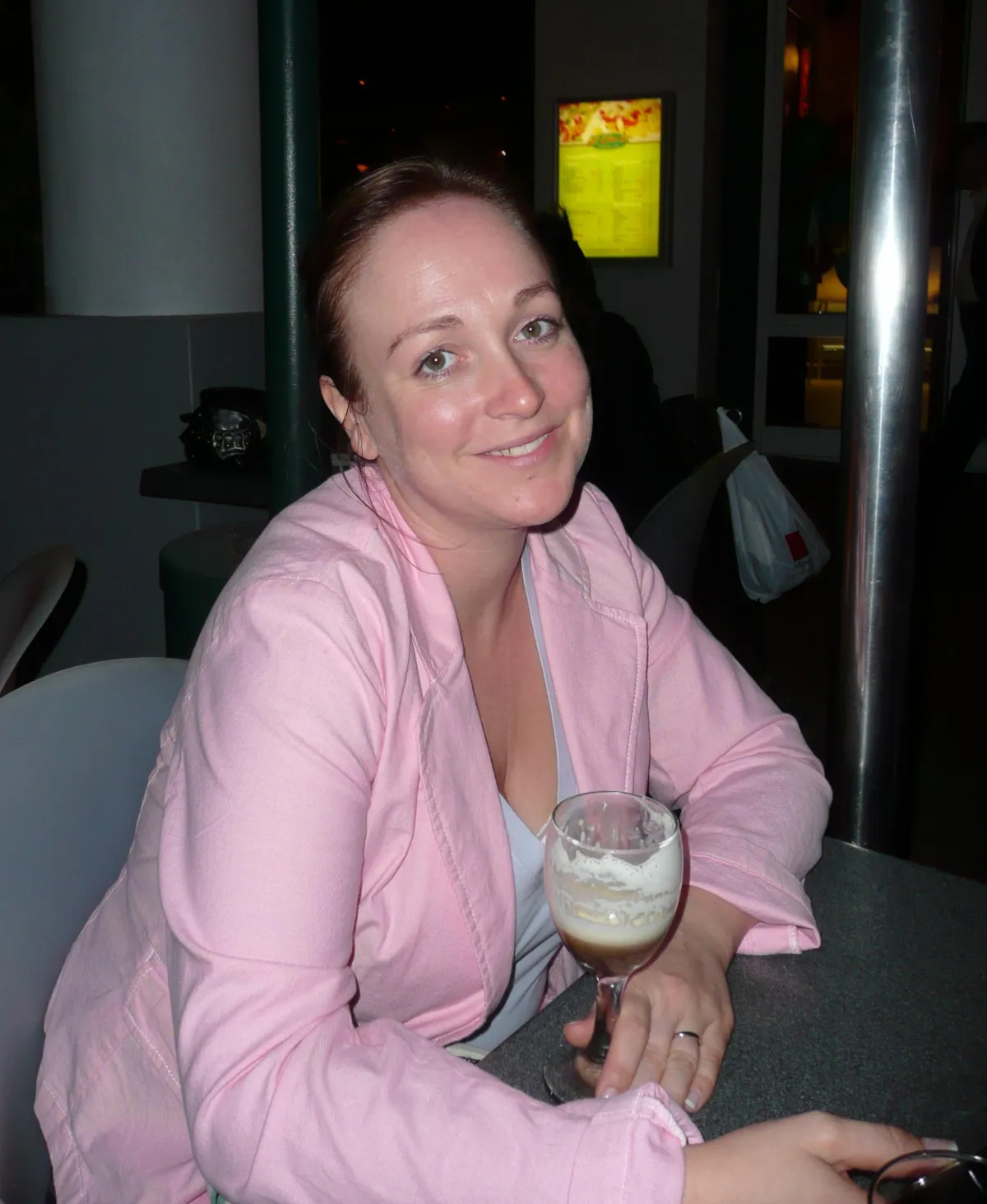 Picture of a woman who looks happy but tired of second guessing herself
