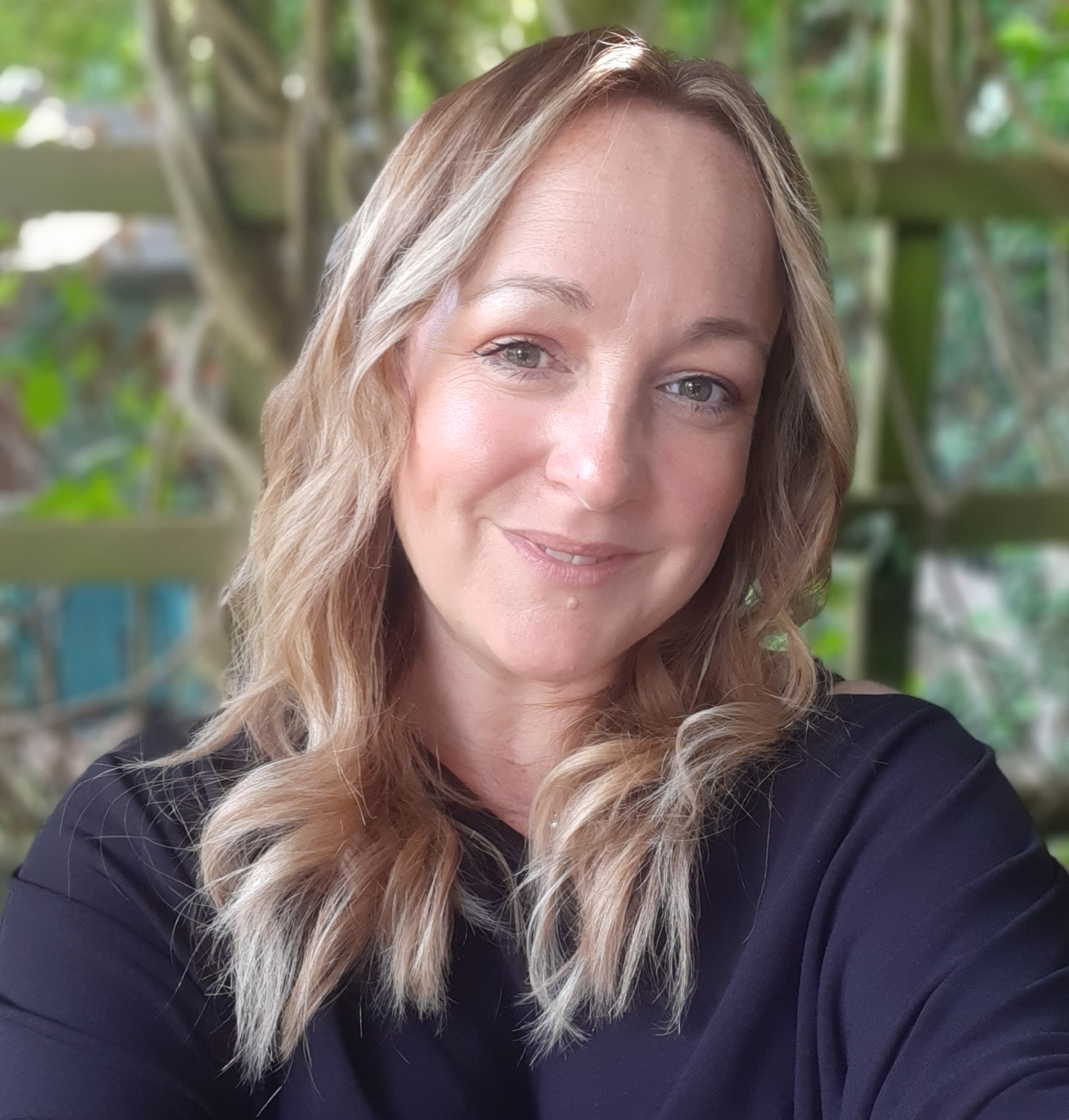 A happy and confident looking Wealth Activator