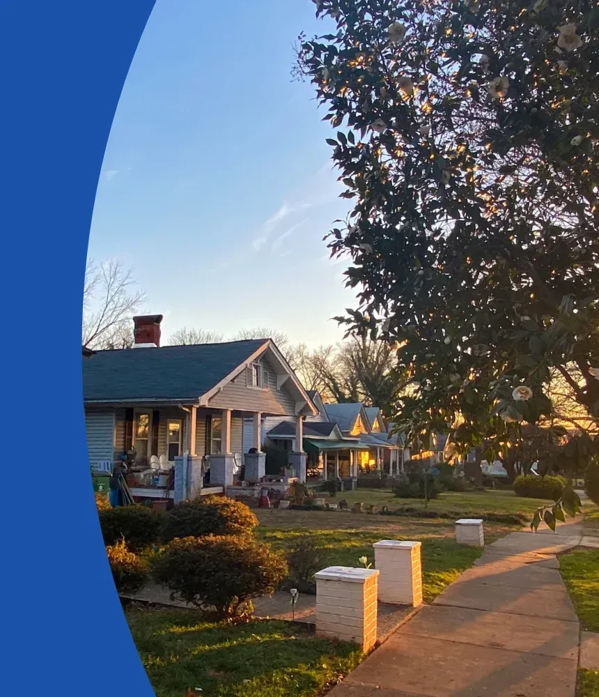 Residential neighborhood homes with sidewalks and front yards in Winston-Salem, NC where Fresh Binz336 provides pressure washing and trash bin cleaning services.