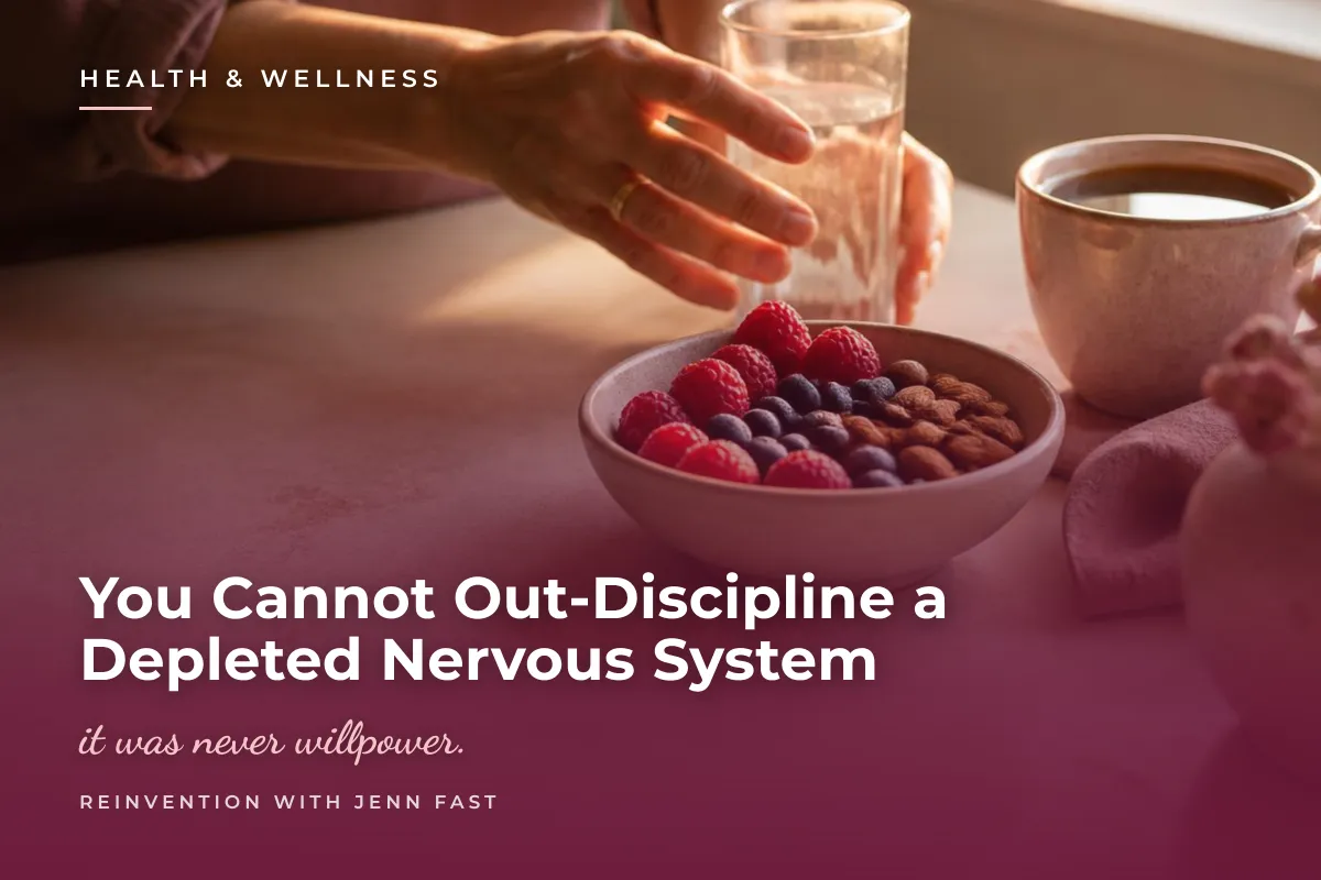 A woman's hand reaches for a glass of water beside a bowl of raspberries, blueberries, and almonds and a cup of coffee, in warm late-afternoon window light. Text reads: Health and Wellness. You Cannot Out-Discipline a Depleted Nervous System. It was never willpower. Reinvention with Jenn Fast.