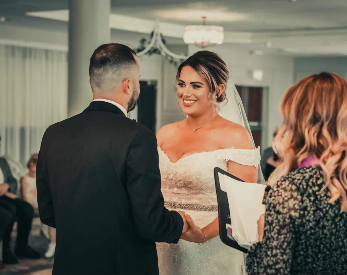 Couple exchanging vows with interfaith minister at Irish wedding