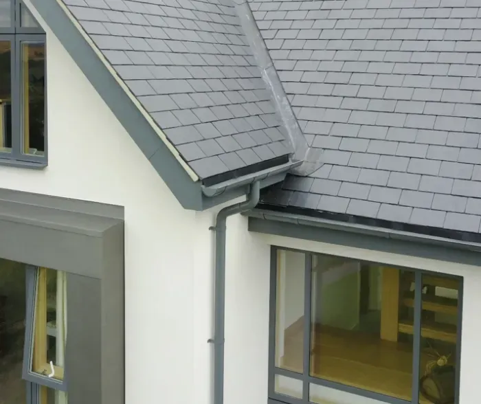 An aerial view of a parking lot with lots of solar panels