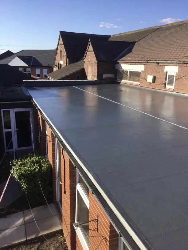 Buildings with tiled roofs and dormer windows.