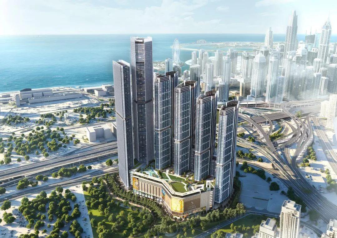 Sobha Central skyline with six towers, lush greenery, and connected road networks in the heart of Dubai.