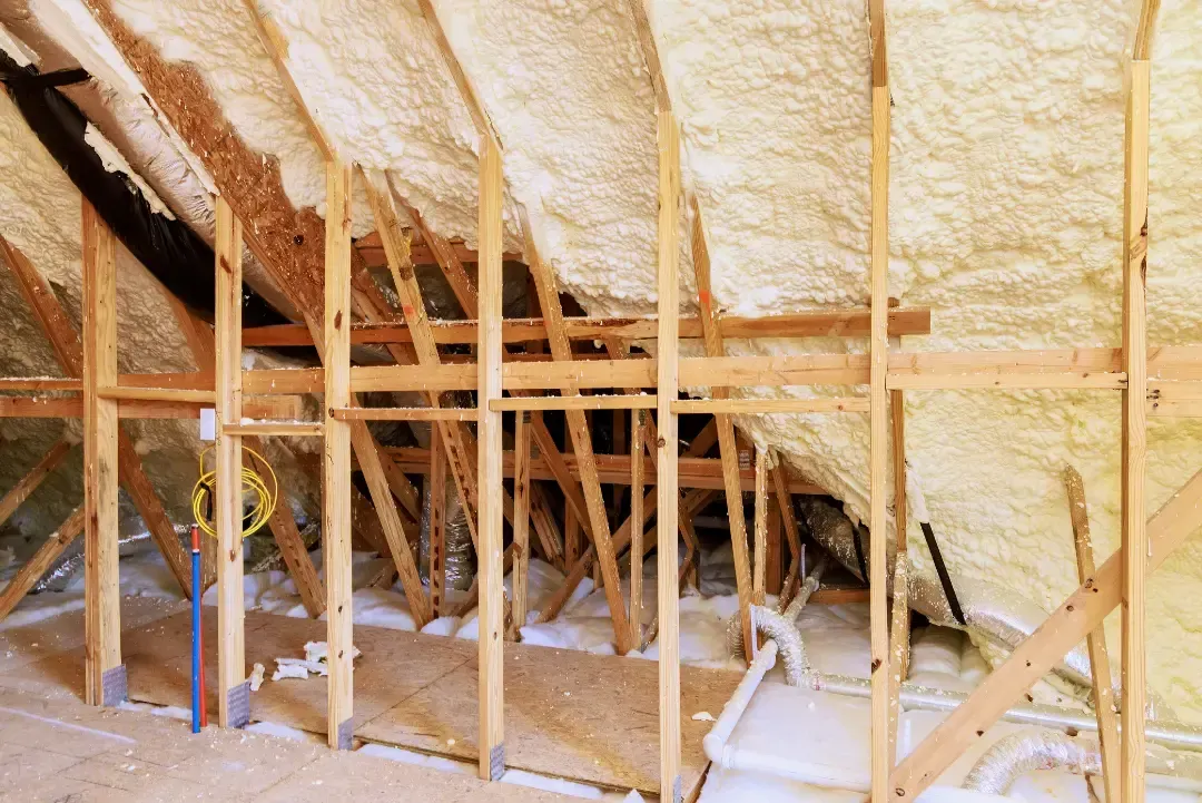 Blown-in insulation installed in attic to reduce noise transmission and improve soundproofing in Astor, FL