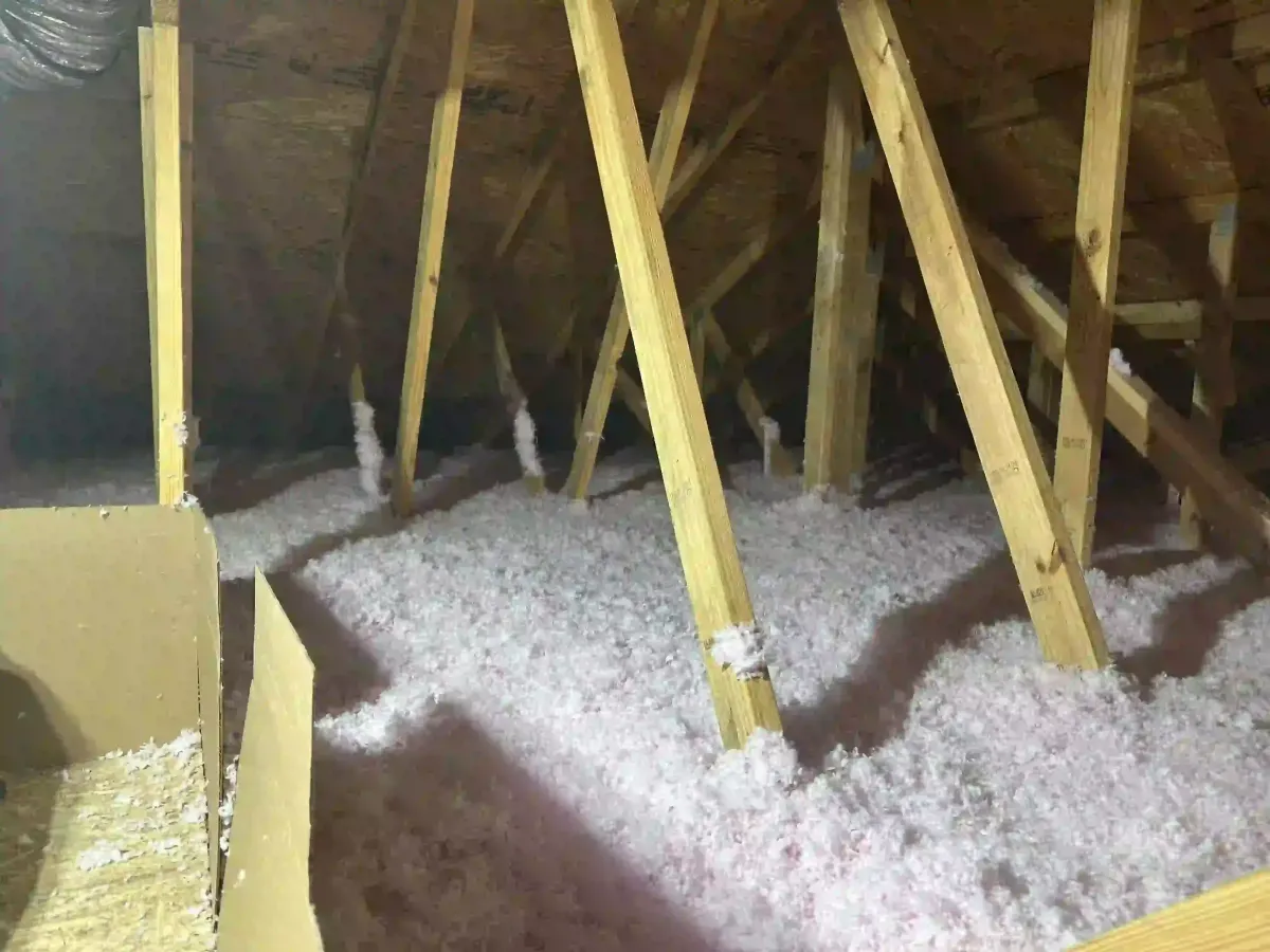 loft blown-in insulation applied in attic space for energy efficiency in Astor Florida residential property