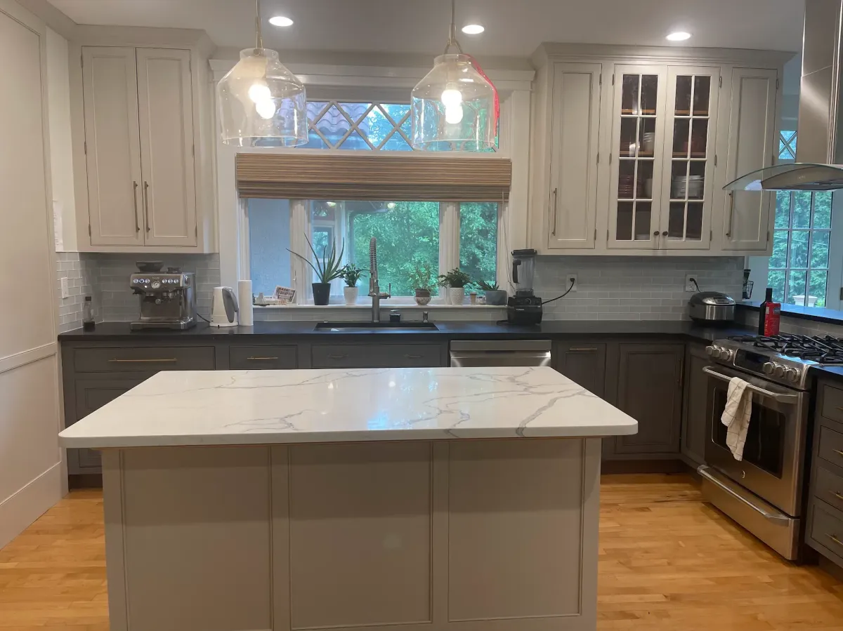 Complete kitchen cabinet refinishing and two-tone painting in Newton, MA.