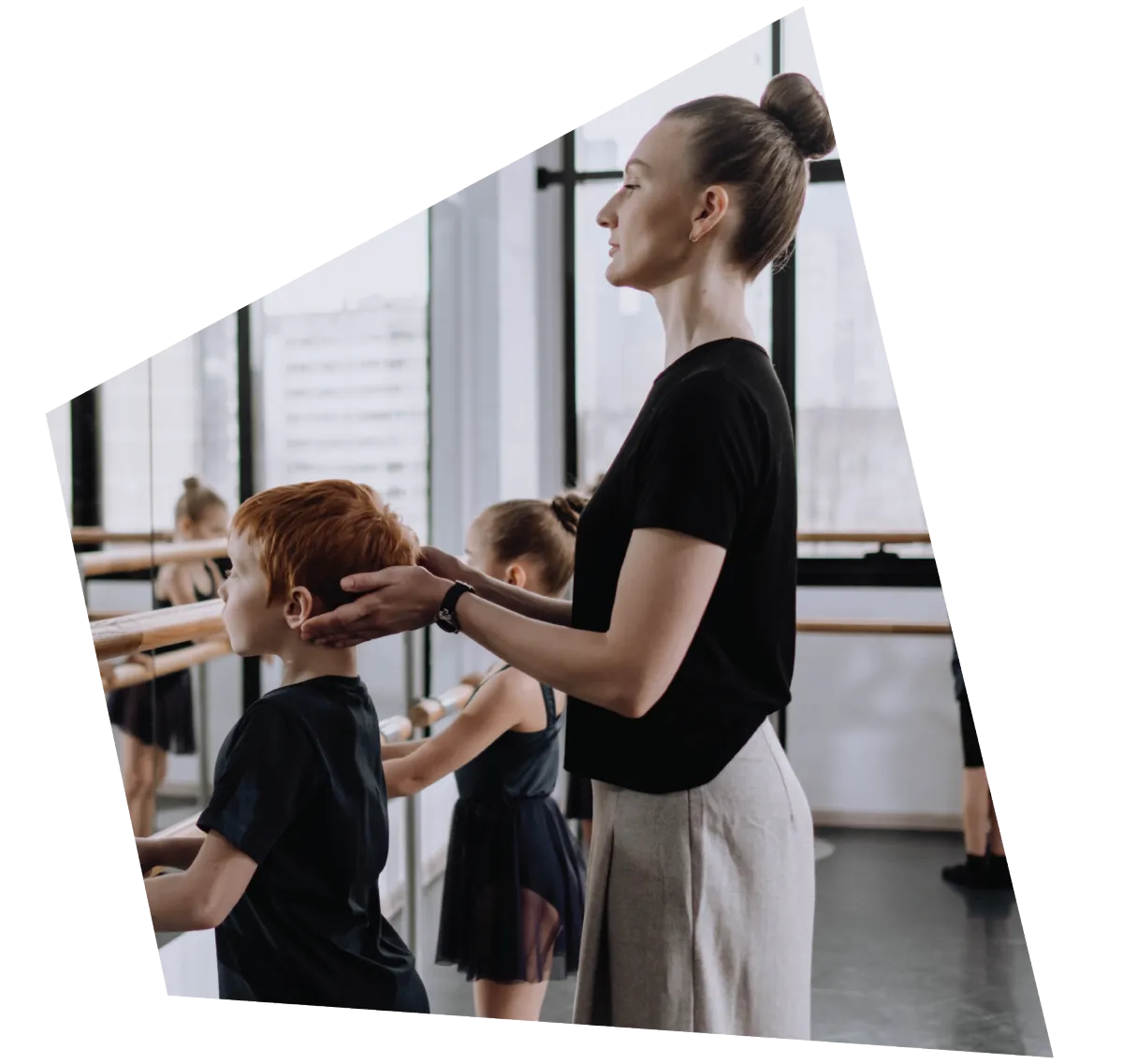 Ballet Teacher Adjusting Posture of Young Ballet Student