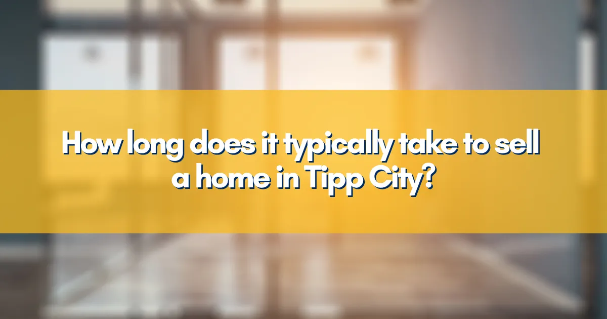A moving truck parked in front of a classic Tipp City home.