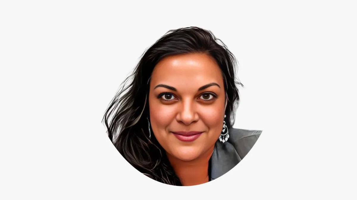 Acquisitions manager reviewing a property sheet on a tablet in a bright meeting room.