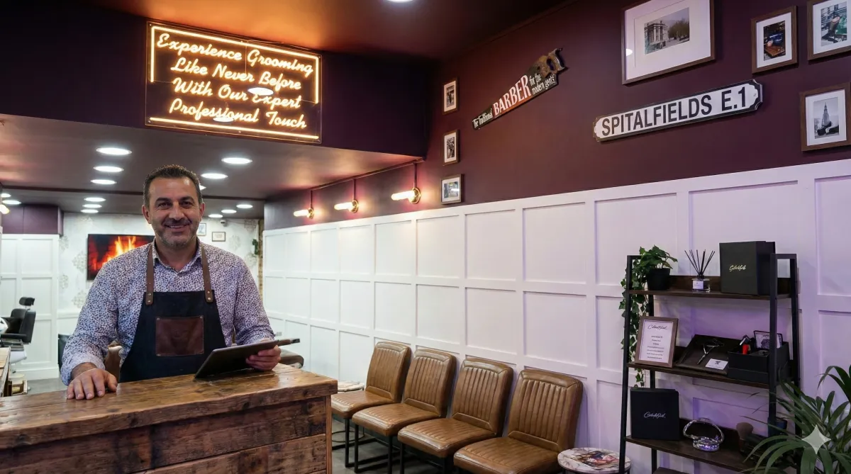 Professional service office with AI-driven scheduling screens, a diverse team collaborating around a digital table, and real-time project dashboards. The space is sleek, minimal, and filled with natural light, emphasizing productivity and seamless workflow.