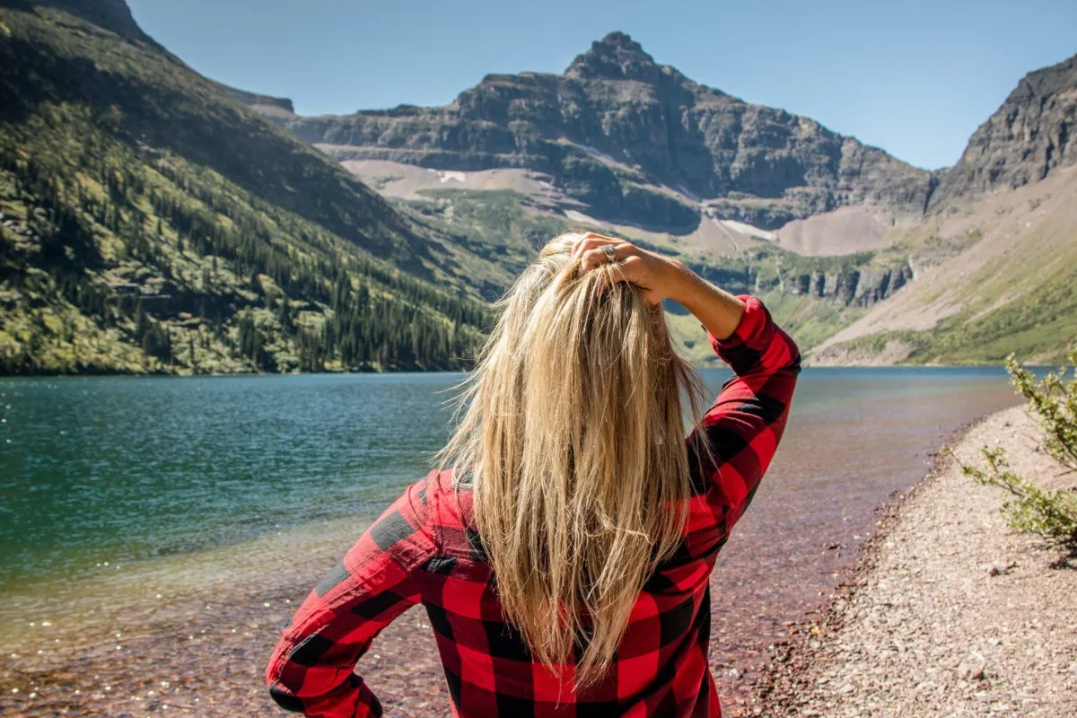 Woman Looking at the River and Mountain Cliff