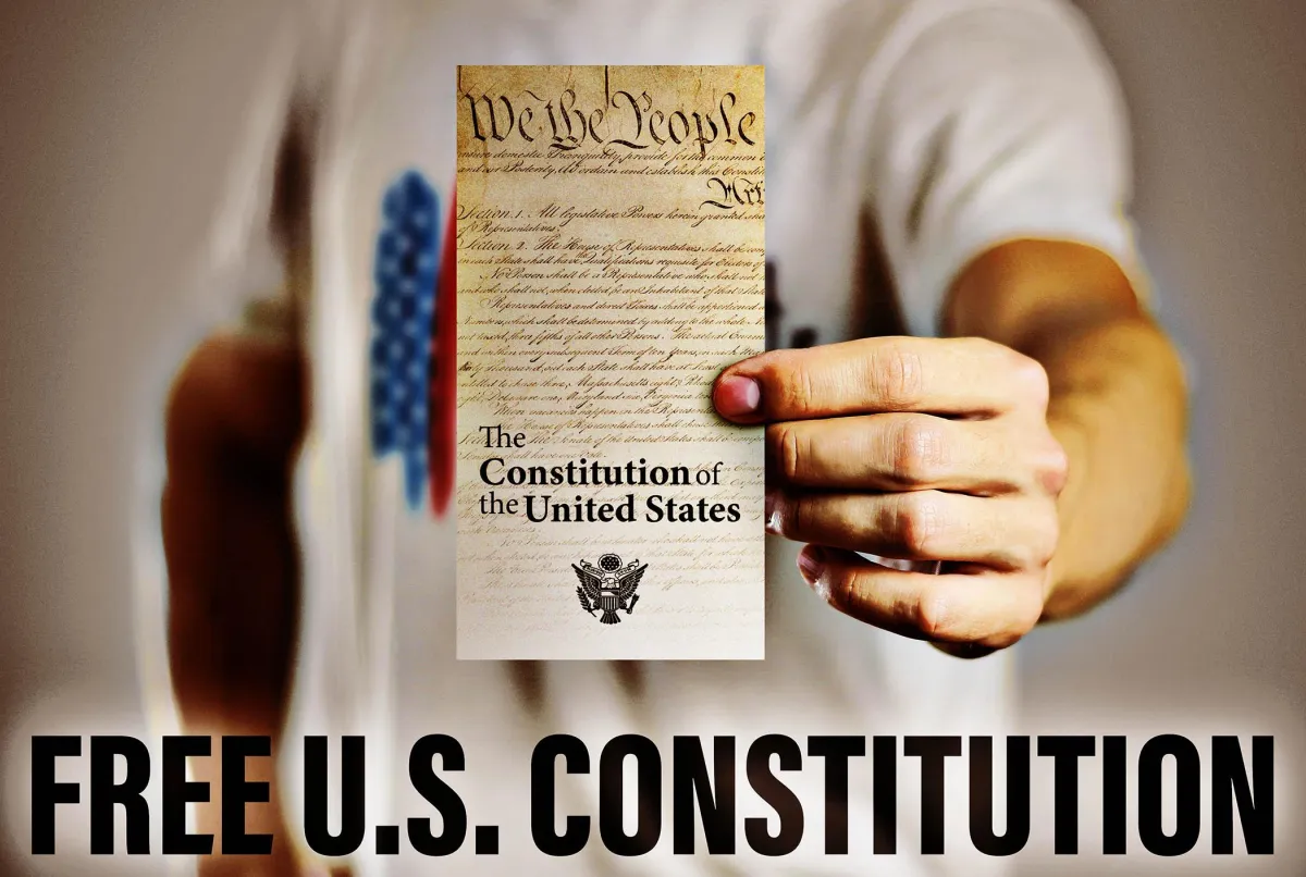 Photo of a man wearing a For Liberty Sake T Shirt. The copy asks you to join our tribe and get 10% off.