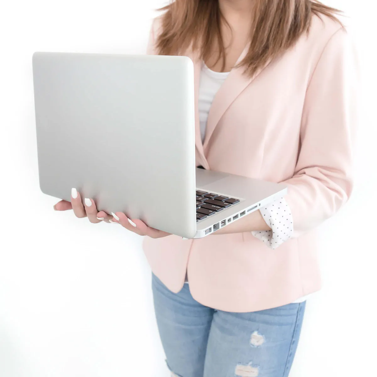 Woman holding a computer building a website