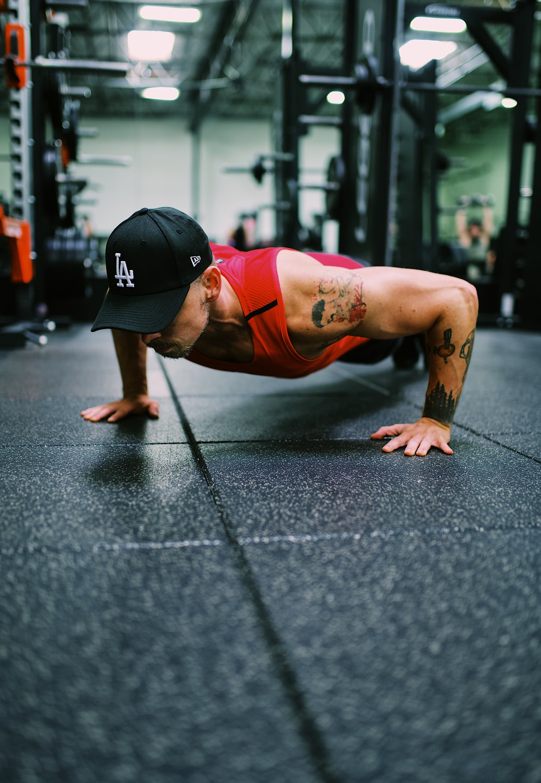 man doing pushup in gym