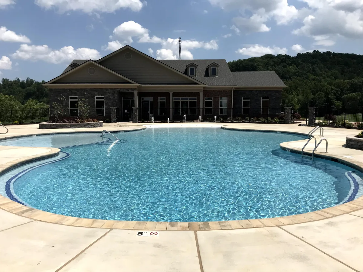 Custom Freeform commercial pool design with in-pool seating.