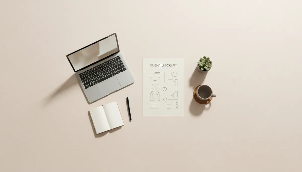 Organized desk with a clear client journey checklist beside a laptop Organized desk with a clear client journey checklist beside a laptop
