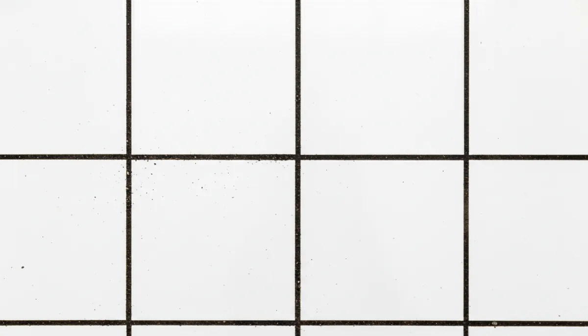 Add 2 additional unique images to this blog post about tile and grout cleaning in Hemet, CA. Do not remove or change any existing images or text. Place new images at natural content break points — for example, one near the section explaining why grout gets so dark, and one near the section about where tile and grout cleaning matters most in a home. Each new image must be completely different from any existing image in the post. Generate photorealistic images relevant to the section they appear near. Suggested image concepts: (1) A close-up overhead shot of bathroom or kitchen floor tile showing dark discolored grout lines between clean white tiles — clearly illustrating the grout discoloration problem described in that section. (2) A bright, clean kitchen with gleaming tile floors and sparkling white grout lines — showing the result of professional tile and grout restoration, warm natural lighting, inviting home atmosphere. All images must be unique from each other and from any existing images in the post.. Context: This is for a blog post about "Why Your Tile and Grout Gets So Dark — And How to Actually Fix It in Hemet, CA". Style: Professional quality, photorealistic, high resolution