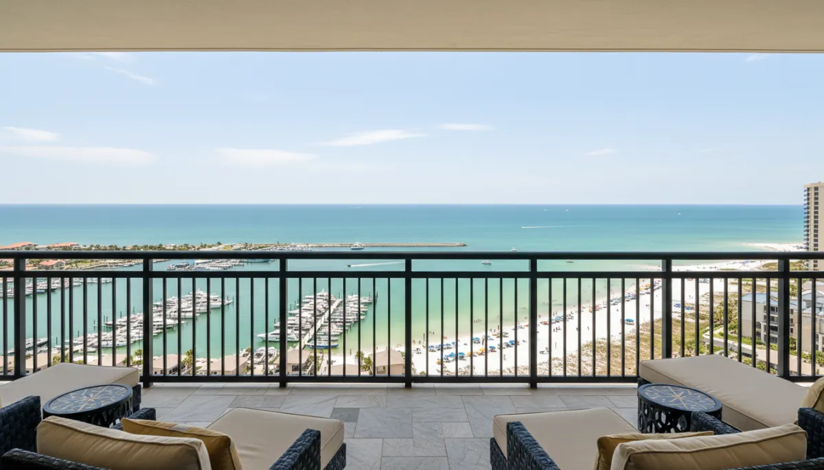 View from a luxury Destin condo balcony overlooking harbor and Gulf