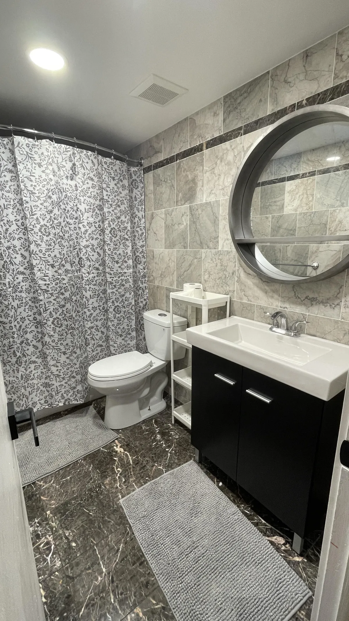 Comfortable furnished bedroom with bed and desk