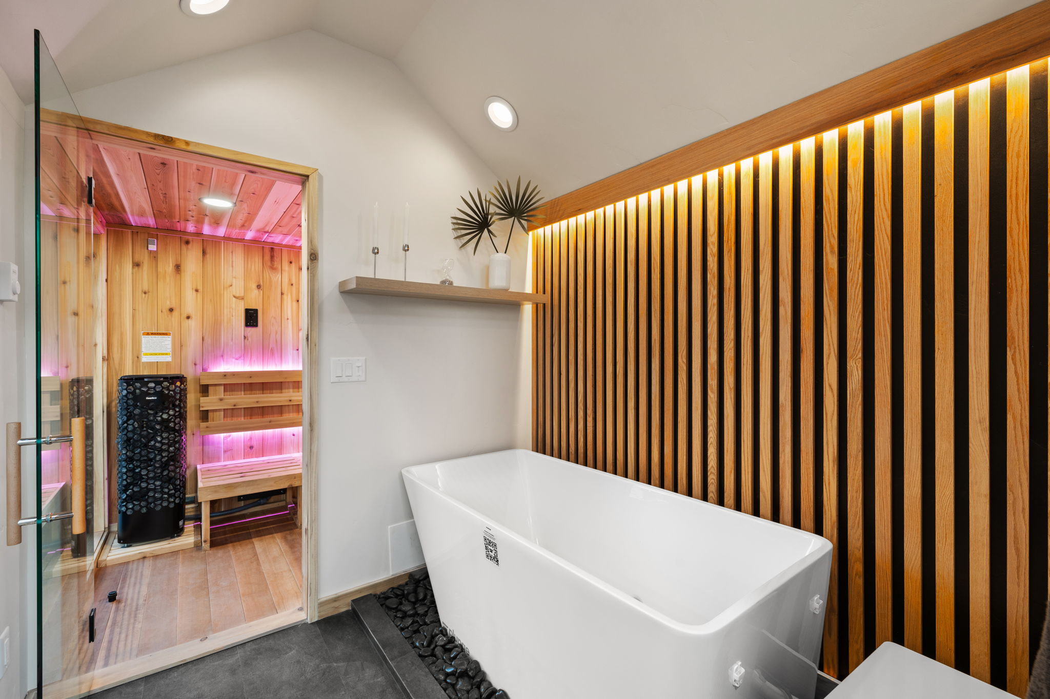 Modern outdoor sauna exterior at dusk — angled view