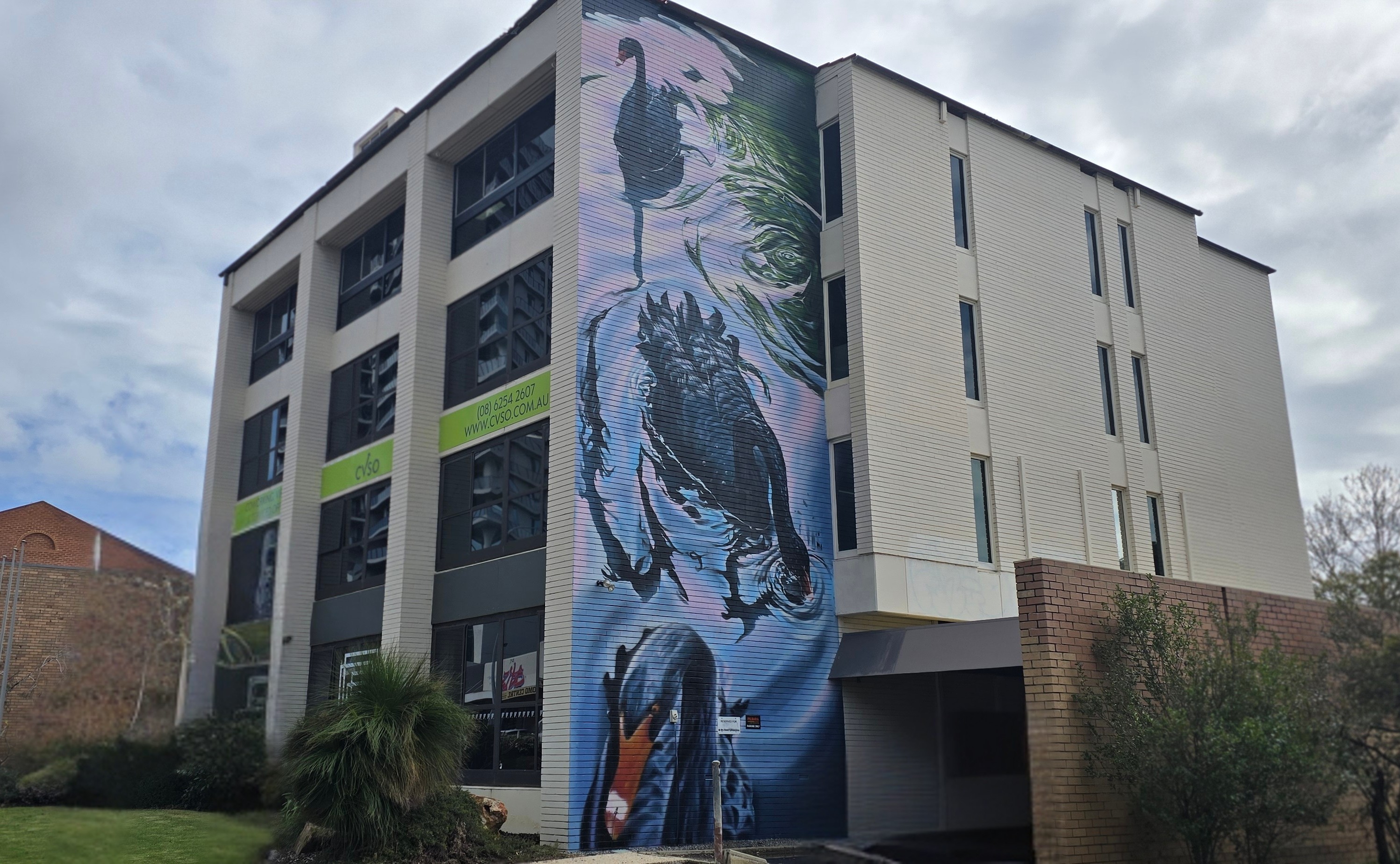 Modern coworking interior with professionals collaborating in a bright Perth workspace