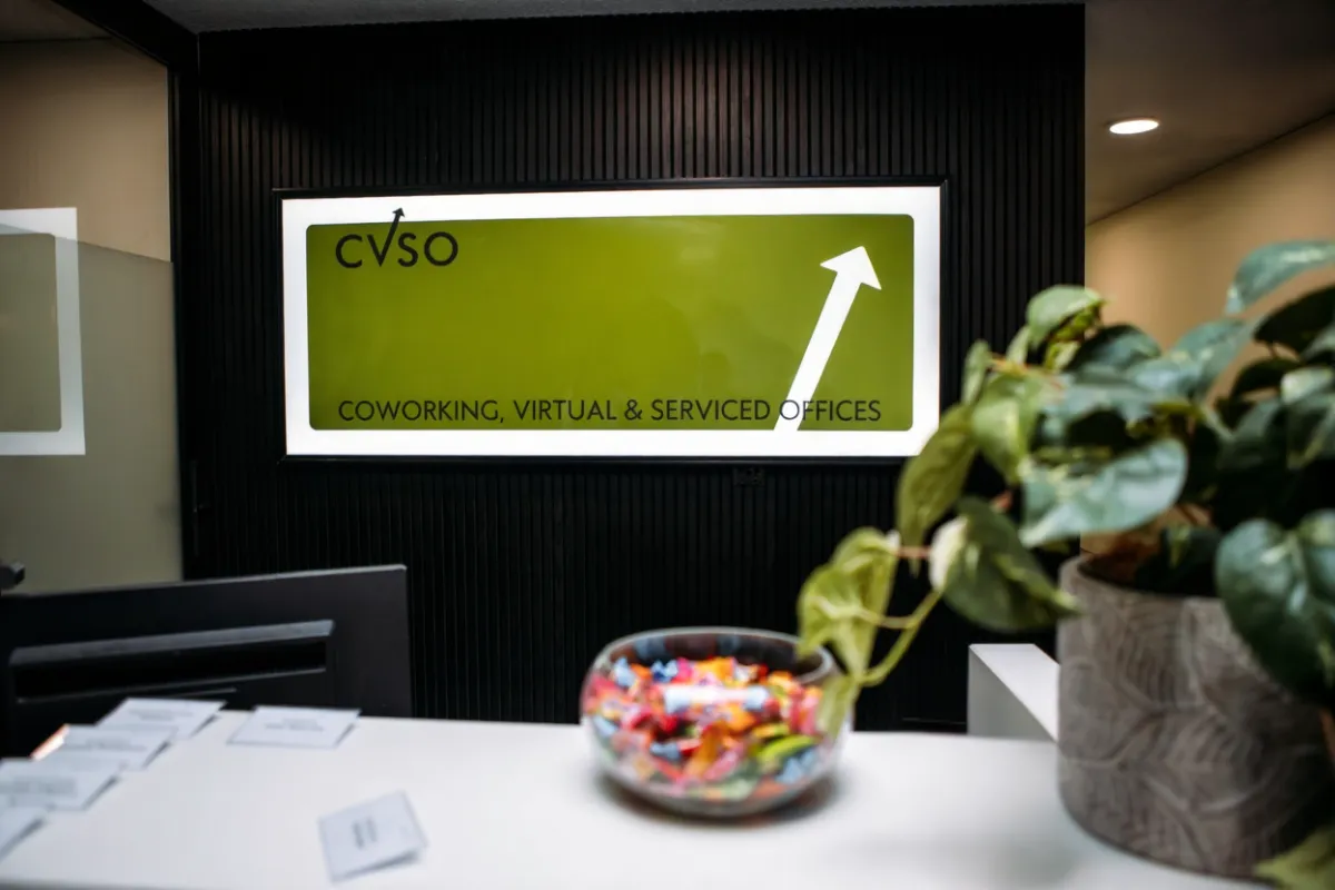 CVSO reception desk with illuminated CVSO sign for coworking, virtual and serviced offices