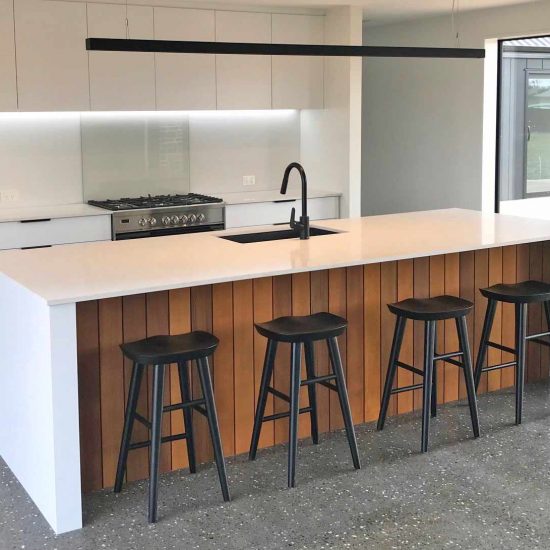 Residential kitchen joinery with timber detailing and black accents