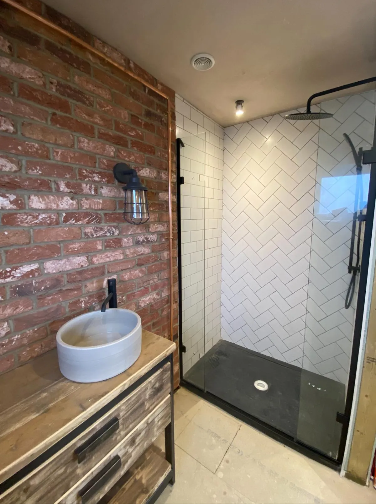 Renovated bathroom with walk-in shower and tile work
