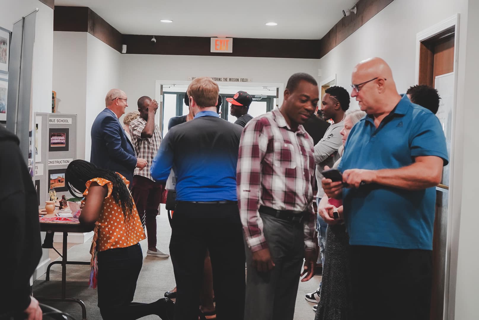 Warm smiling church family and pastor welcoming visitors to Charity Baptist Church