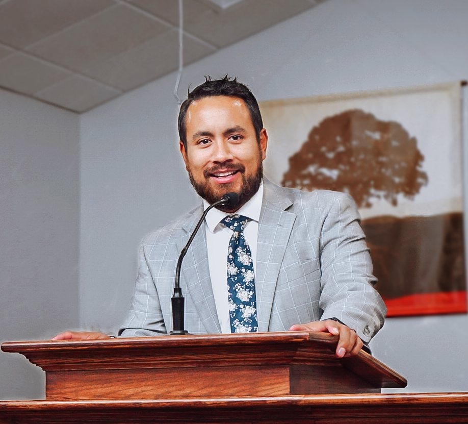 Pastor at the pulpit delivering a Bible message