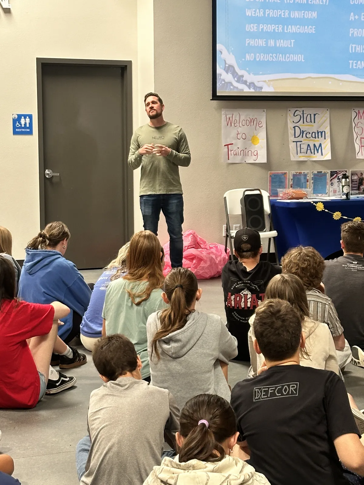NeuroPro keynote speaker presenting to a large audience