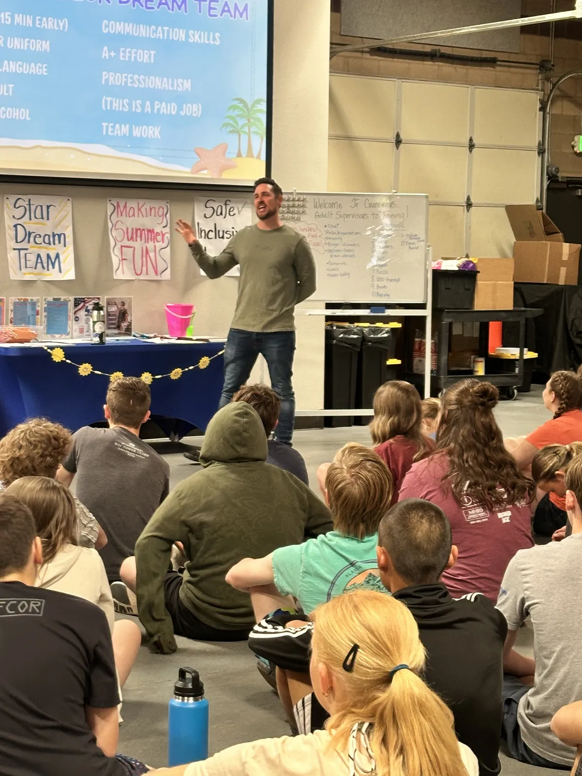 NeuroPro speaker presenting on stage to a live audience