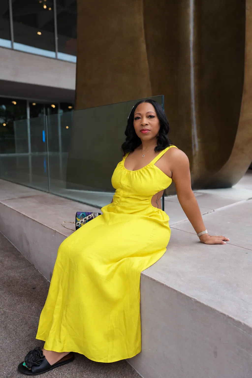 Chanda Coston candid lifestyle photo seated and smiling