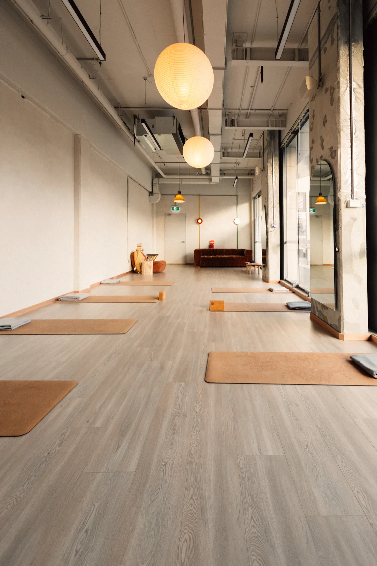 Tall vertical view of mindful yoga practice in tranquil warm morning lighting