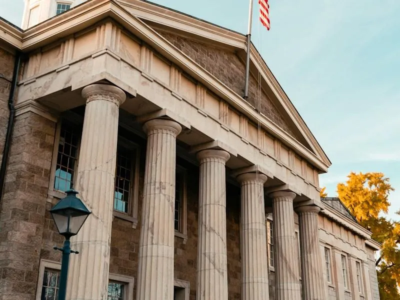 Historic Arlington County government building with columns and flag