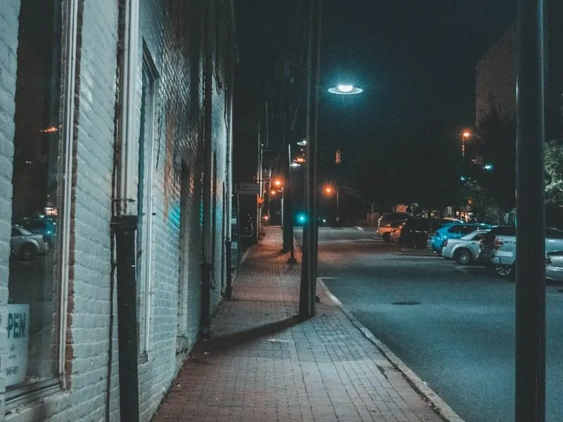 Cars parked along a quiet Fairfax, Virginia street at night