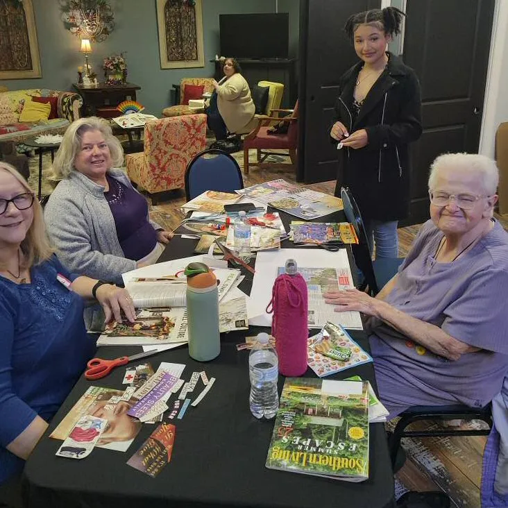 Creating Vision Boards - Community group around table