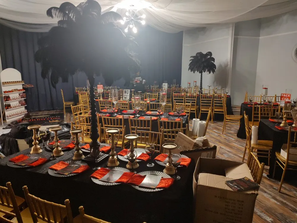 Elegant banquet setup with black and gold decor