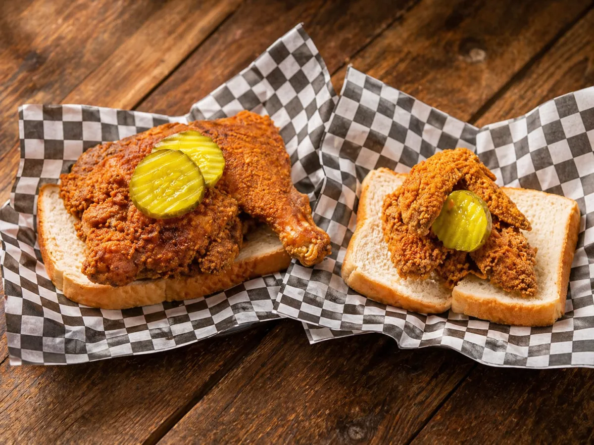 Crispy hot chicken on white bread with pickles