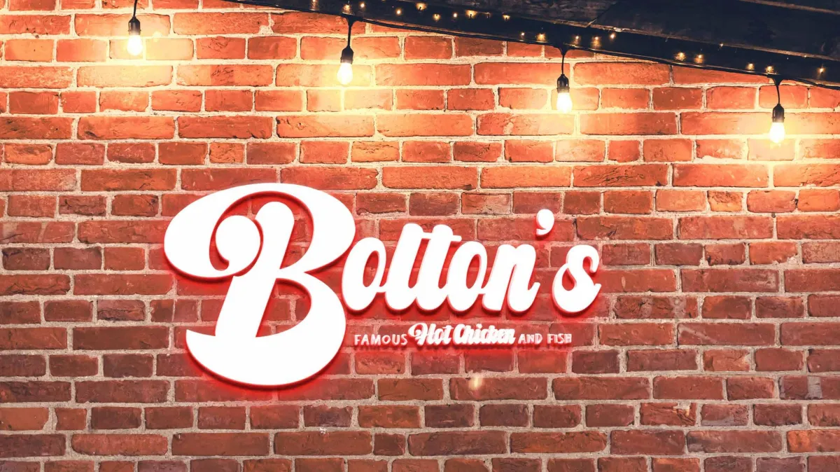 Bolton's Famous Storefront Neon Sign