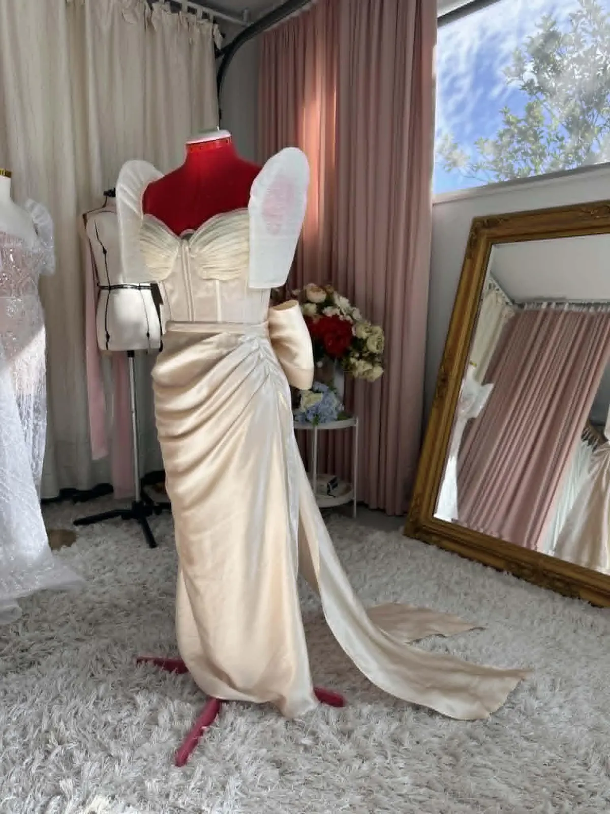 Hand stitching the construction of a Filipiniana wedding dress