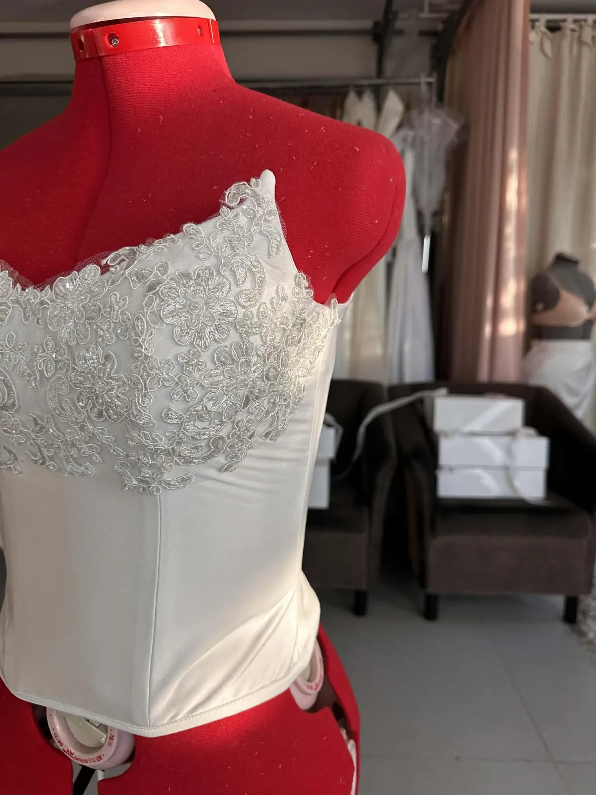 A bride during her custom Filipiniana wedding dress fitting