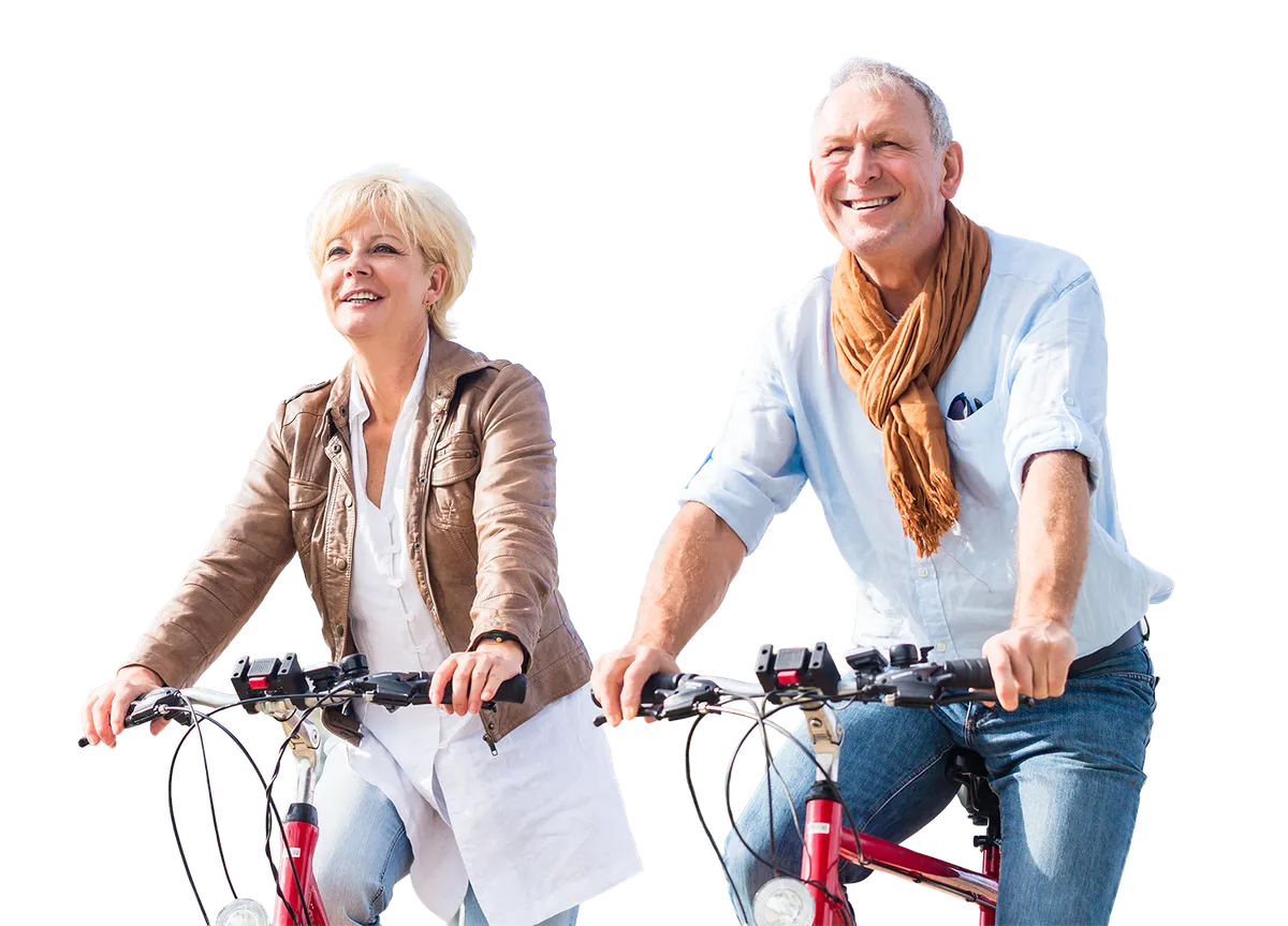Senior couple with bicycles on bridge