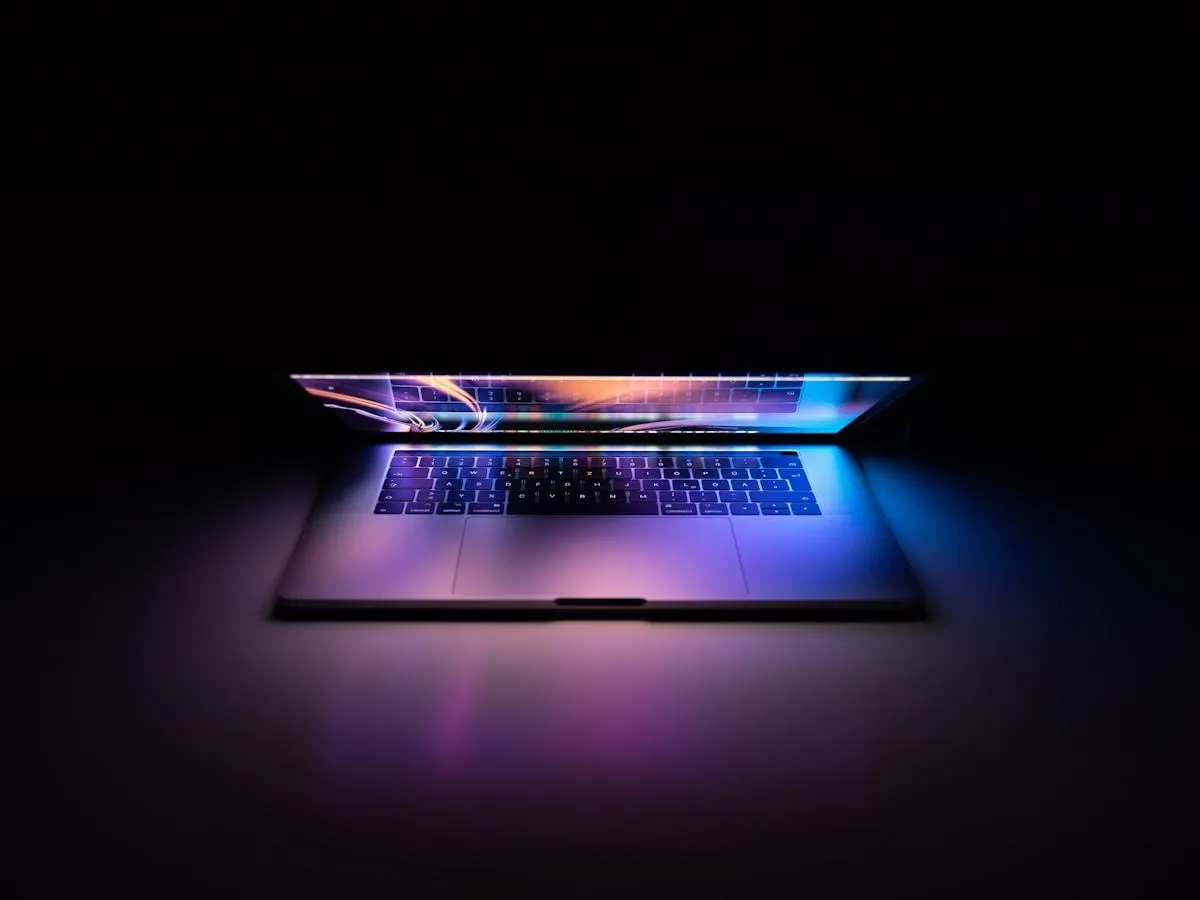 MacBook Pro showing a modern custom website dashboard
